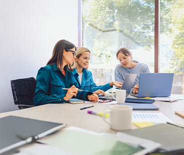 female office staff discuss-work