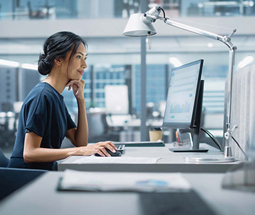 Asian woman working on a desktop