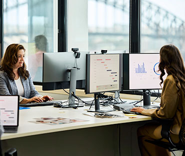 businesswomen preparing financial records