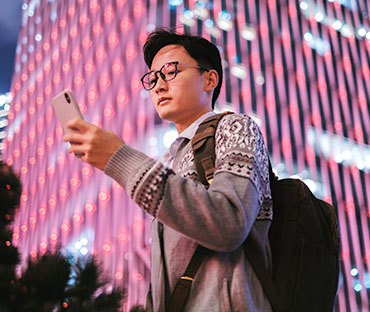 young asian business man using smartphone