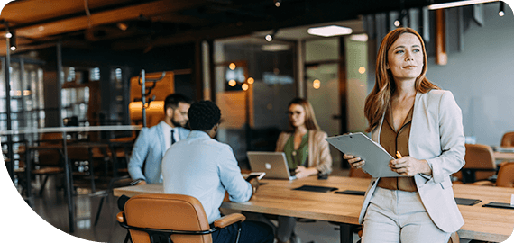 Confident businesswoman and her team